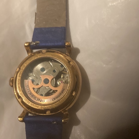 Gorgeous Stuhrling woman’s skeleton watch with several colored bands. - Picture 3 of 9